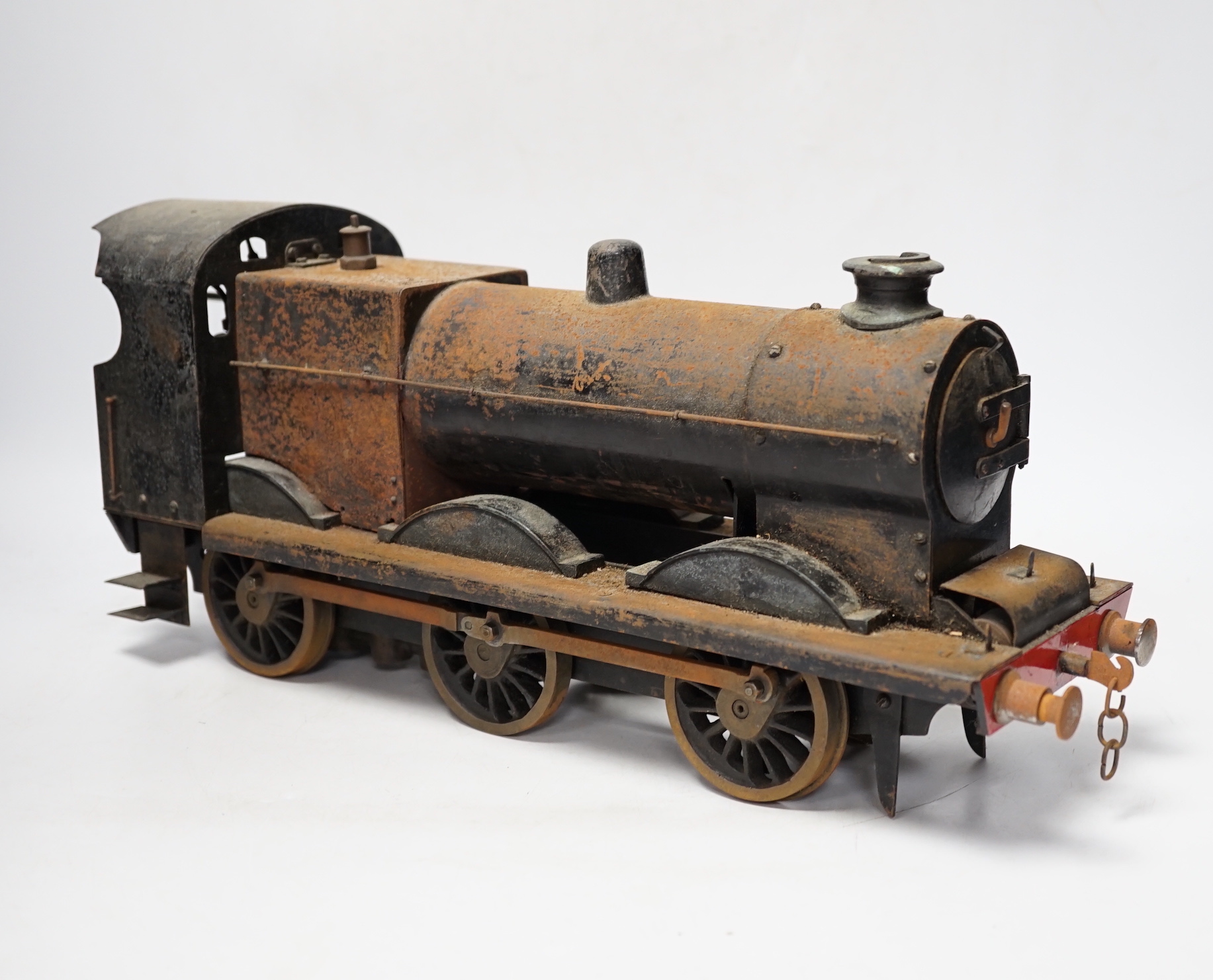 A paraffin/meths fired 2.5 inch live steam BR class 4F 0-6-0 tender locomotive, single inside cylinder, six wick burner, safety valve and whistle under running board, 72cm long over the buffers